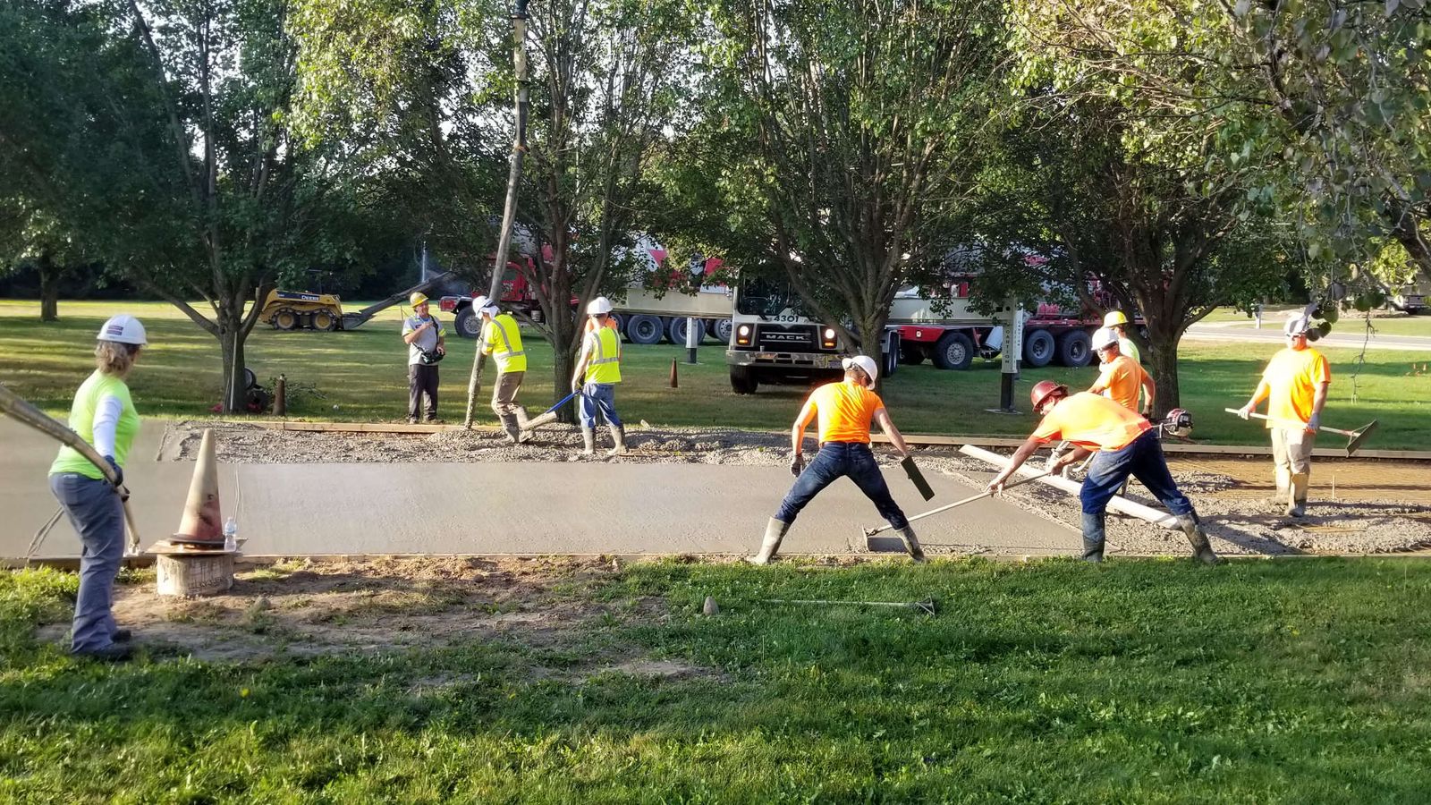 Concrete crew placing and finishing a flatwork pour